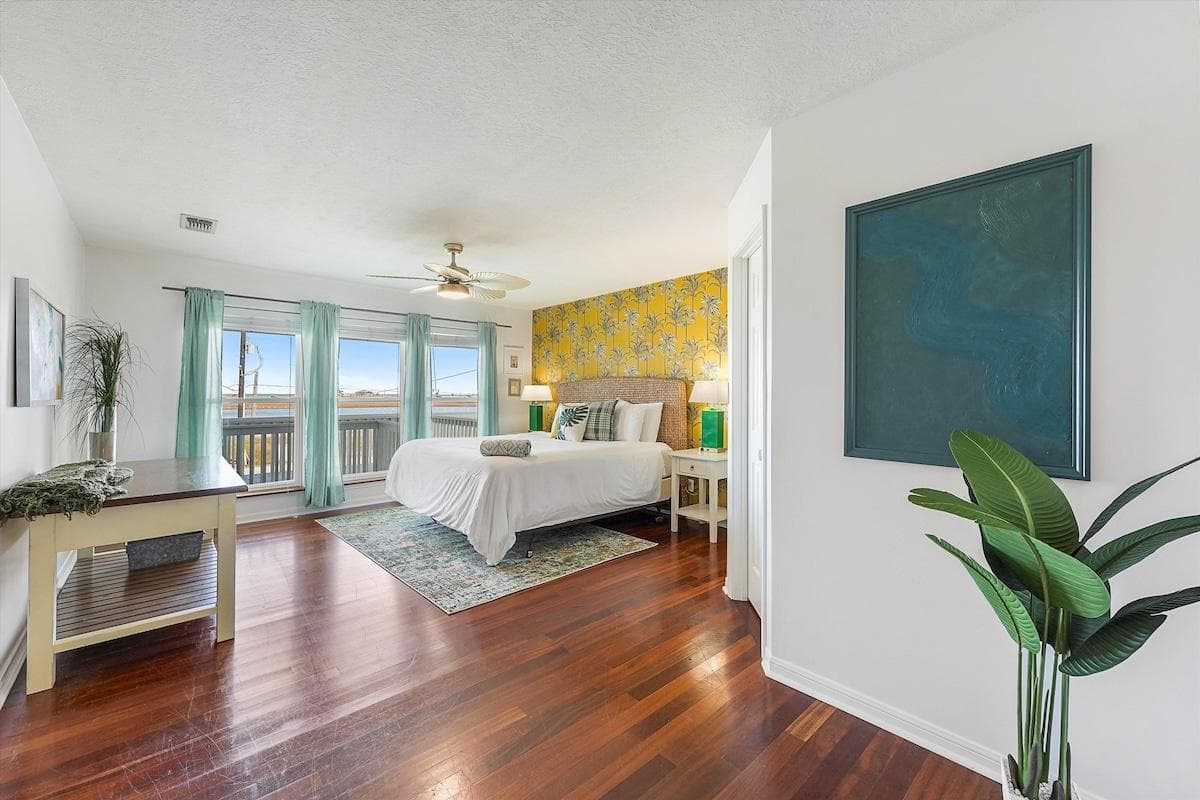 The massive master bedroom is exactly what you’d expect- a serene space away from the bustle, with amazing views of West Bay. En-suite full bathroom with tub and shower, and double vanity